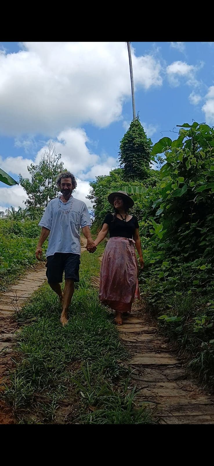 Wade and Clarisa walking together on the land at Dreamglade